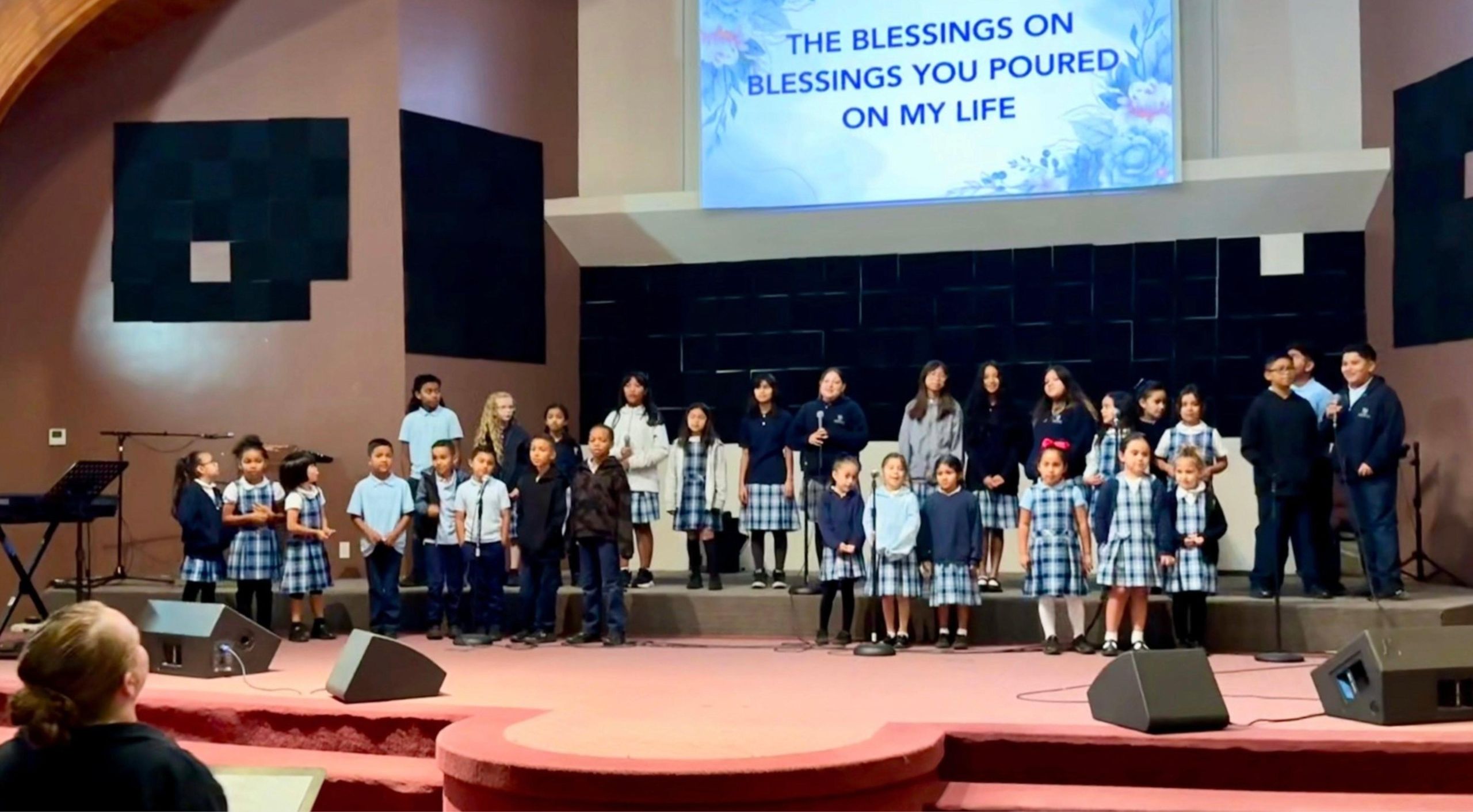 children performing in chapel